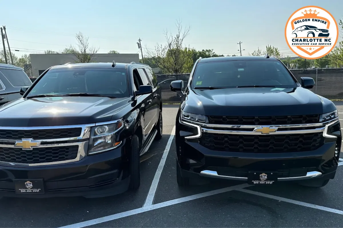 Two black SUVs parked side by side